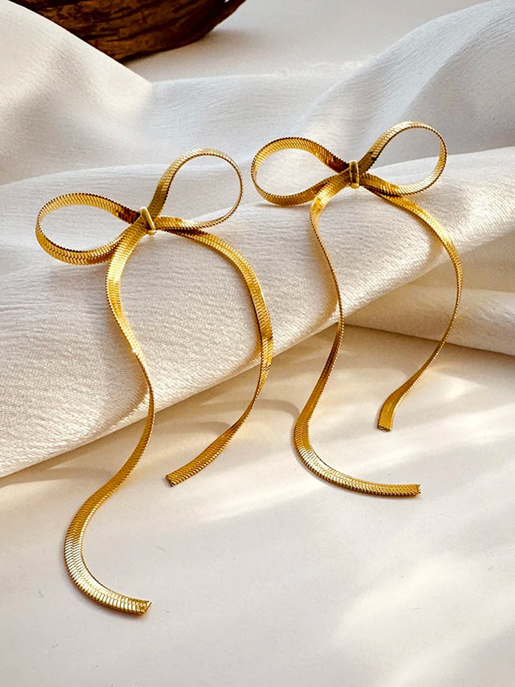 Cate – Boucles d’Oreilles Longues Nœud Chaîne Serpent Dorées