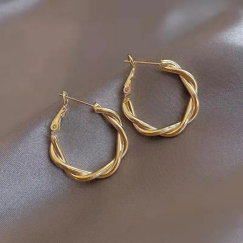 Zonia - Boucles d’Oreilles Nœud Doré Élégantes