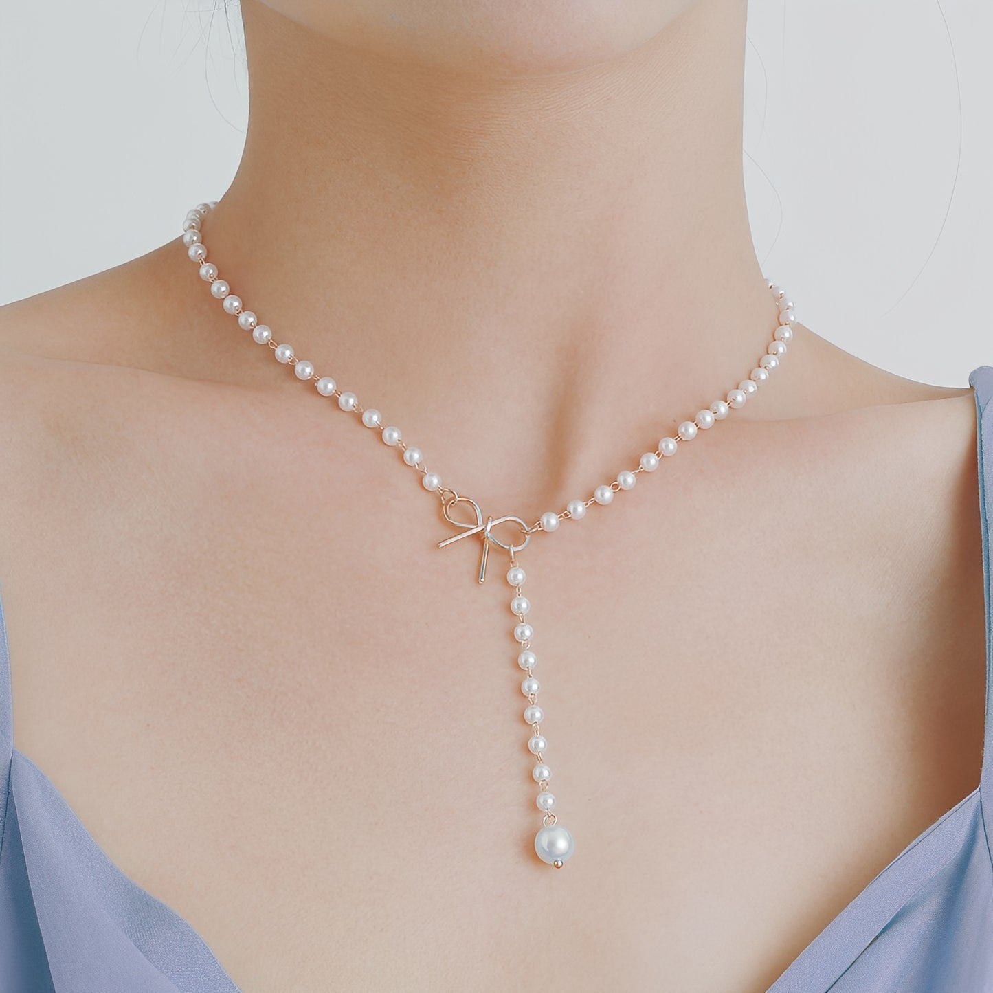 Antoneth – Collier Pendentif Nœud Papillon avec Perle