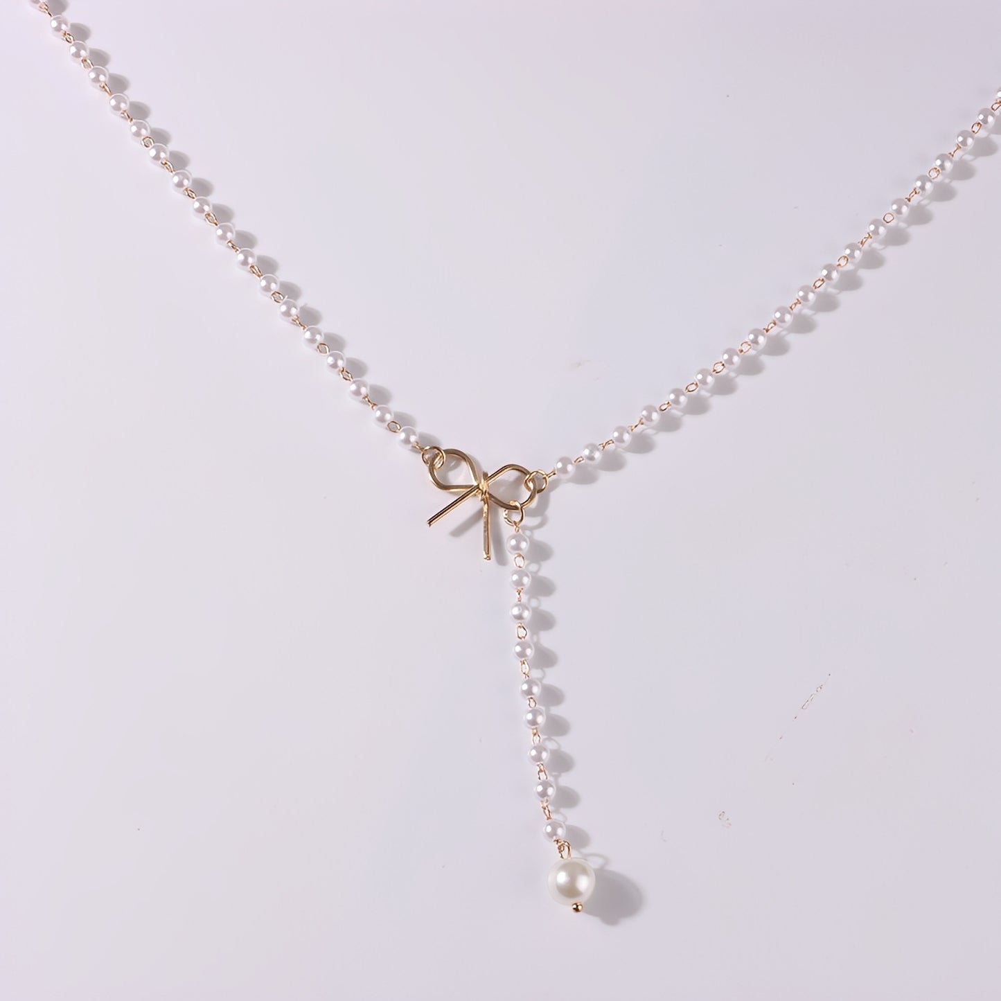 Antoneth – Collier Pendentif Nœud Papillon avec Perle
