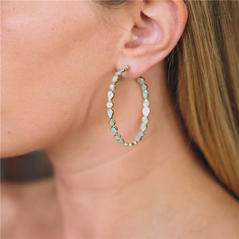 Luminose Élégance – Boucles d'oreilles en or et opale bleue