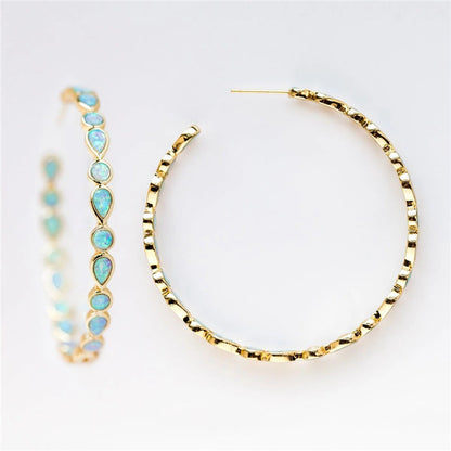 Luminose Élégance – Boucles d'oreilles en or et opale bleue