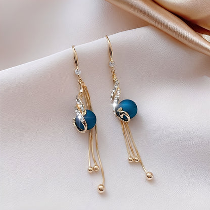 Sheynn – Boucles d’Oreilles de Fête avec Perles Bleues