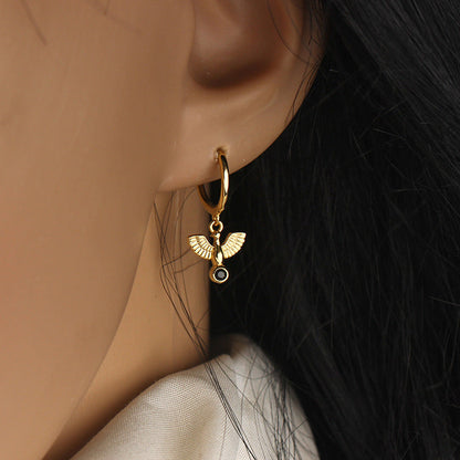 Paola – Créoles Huggie Dorées à Pendentif Colombe