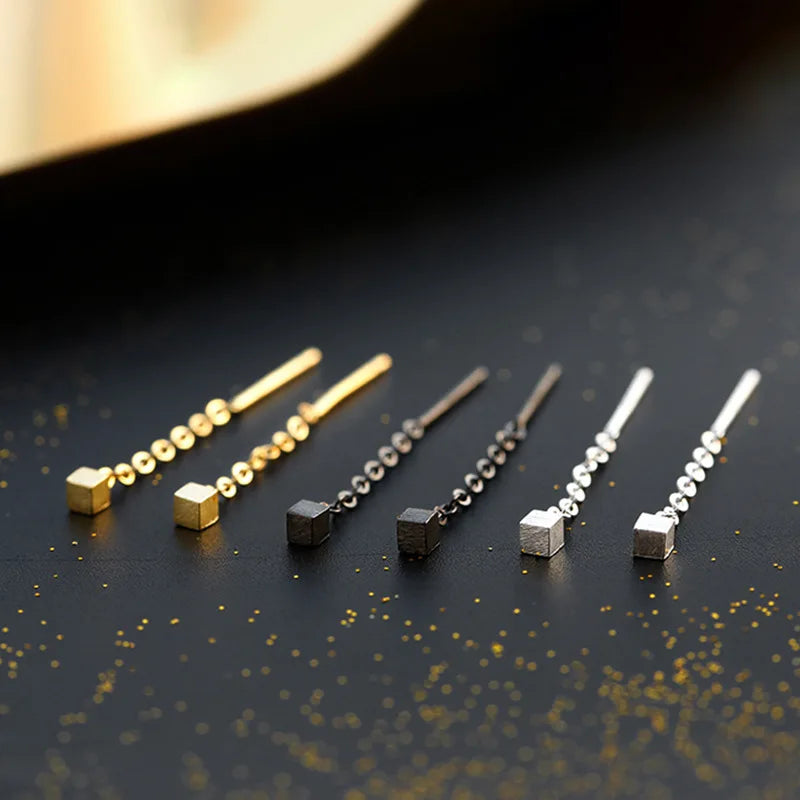 Kaelen – Boucles d'Oreilles Cube et Glands Élégants