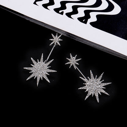 Aura – Boucles d'Oreilles Cristal Argentées Éclat Étoilé