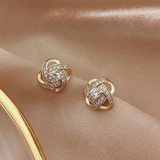 Ryoshi – Boucles d'Oreilles Croix Fleur Spirale