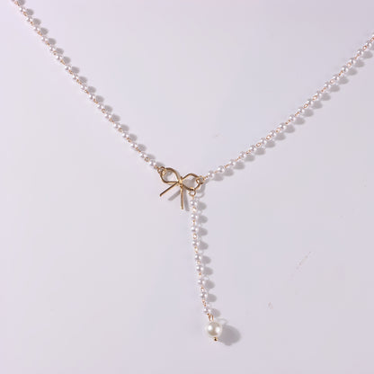 Antoneth – Collier Pendentif Nœud Papillon avec Perle