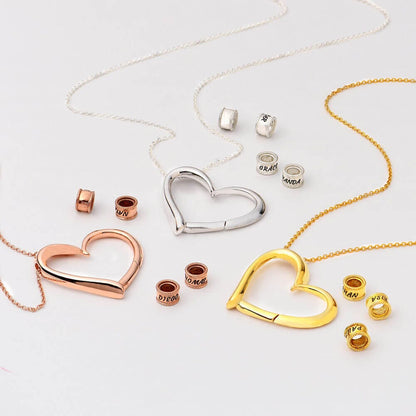 Maya – Collier Cœur avec Anneaux Gravés