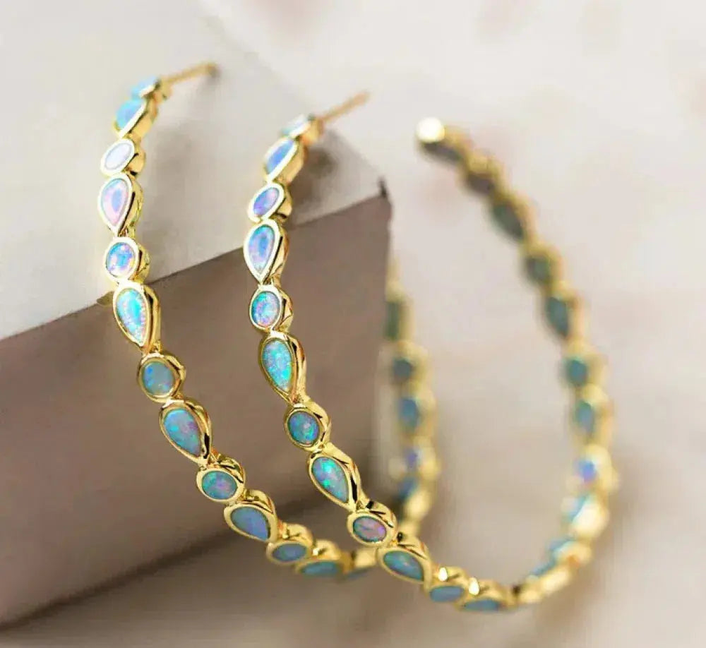 Luminose Élégance – Boucles d'oreilles en or et opale bleue